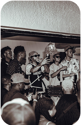 Crowd celebrating at an indoor party
